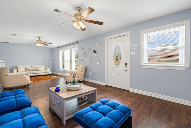 211 Second St, Denton, TX 76201 - living room featuring a ceiling fan and dark wood-type flooring