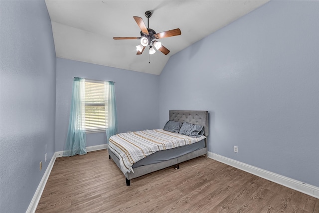 224 Cimmarron Vista Ct, Runaway Bay, TX 76426 - bedroom featuring wood finished floors, vaulted ceiling, and ceiling fan