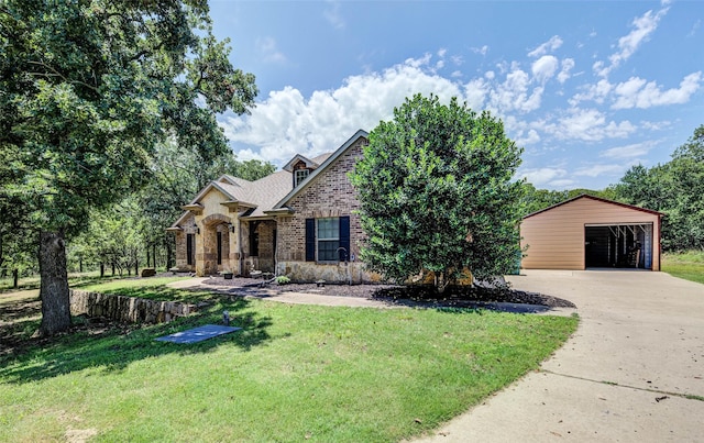 224 Cimmarron Vista Ct, Runaway Bay, TX 76426 - view of front of property with driveway, a front lawn, brick siding, a garage, and an outdoor structure