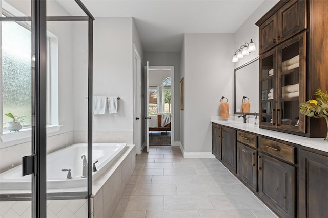 1924 Grey Bark St, Fort Worth, TX 76008 - bathroom featuring vanity, ensuite bathroom, a garden tub, and tile patterned floors