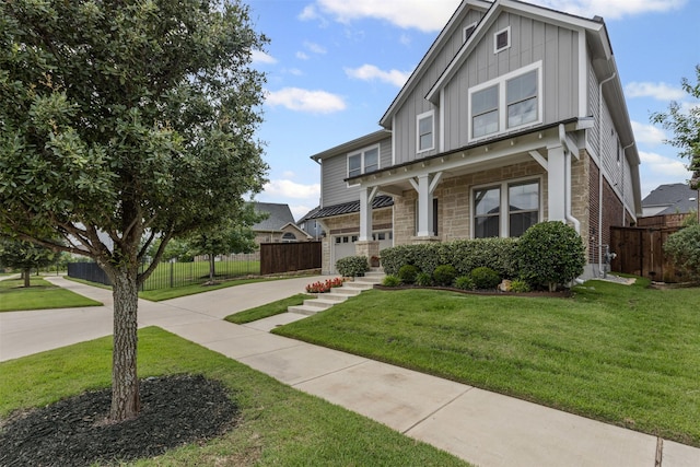 1924 Grey Bark St, Fort Worth, TX 76008 - view of front of house featuring board and batten siding, driveway, and stone siding