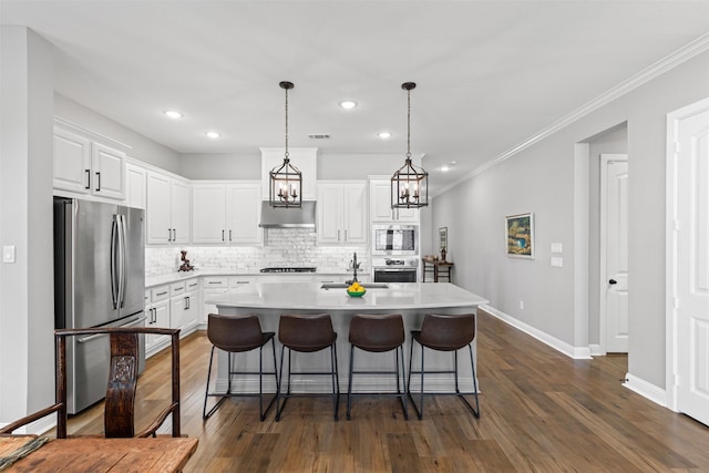 1924 Grey Bark St, Fort Worth, TX 76008 - kitchen featuring appliances with stainless steel finishes, backsplash, white cabinetry, light countertops, and dark wood finished floors