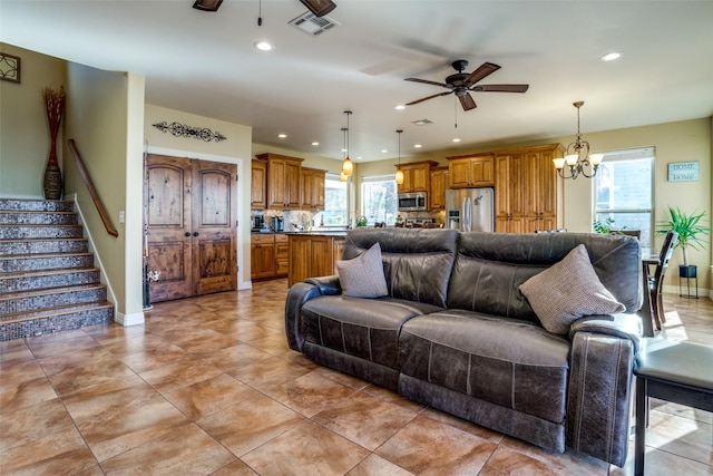 10040 Brinwood Dr, Wills Point, TX 75169 - living room featuring a ceiling fan, recessed lighting, a chandelier, stairway, and light tile patterned floors