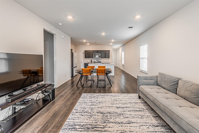 3233 Perman Dr, Mesquite, TX 75126 - living room featuring dark wood-type flooring and recessed lighting