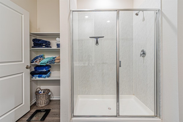 3233 Perman Dr, Mesquite, TX 75126 - bathroom with a stall shower and wood finished floors