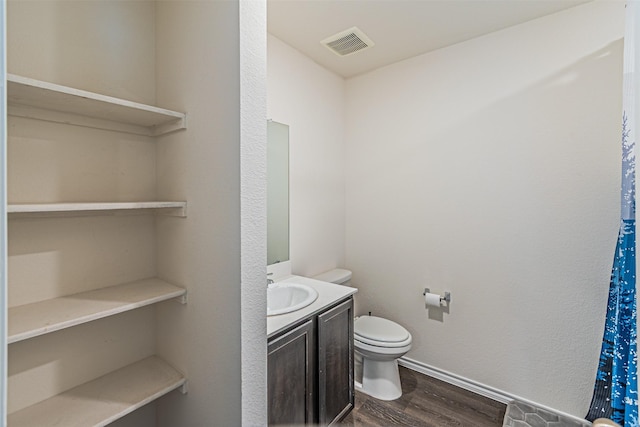 3233 Perman Dr, Mesquite, TX 75126 - bathroom with wood finished floors and vanity