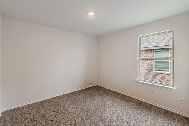 3233 Perman Dr, Mesquite, TX 75126 - carpeted spare room featuring baseboards