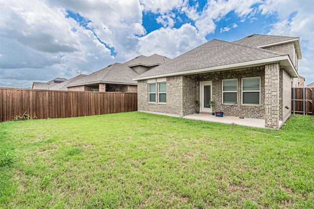 3233 Perman Dr, Mesquite, TX 75126 - rear view of property with brick siding, a patio, a fenced backyard, and roof with shingles