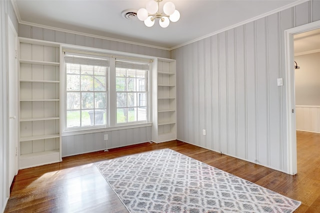 3609 Rogers Ave, Fort Worth, TX 76109 - empty room with a chandelier, wood finished floors, and crown molding