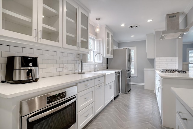 3609 Rogers Ave, Fort Worth, TX 76109 - kitchen with exhaust hood, appliances with stainless steel finishes, tasteful backsplash, white cabinetry, and recessed lighting