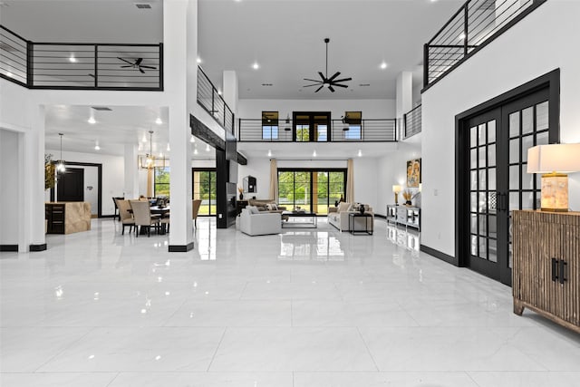 8383 N Fm 2208, Longview, TX 75605 - foyer featuring a towering ceiling, a ceiling fan, and french doors