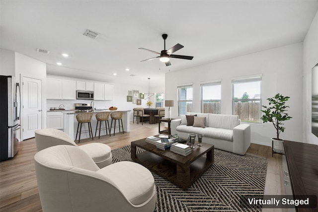 9114 S Field Ln, Arlington, TX 76002 - living room with ceiling fan, light wood-type flooring, and recessed lighting