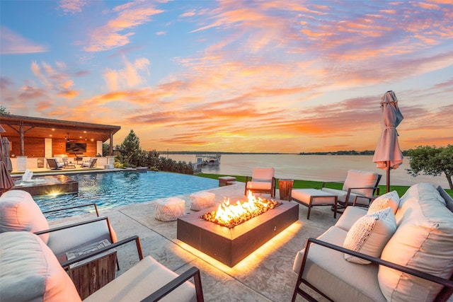 12624 Lake Shore Ct N, Fort Worth, TX 76179 - view of pool with an outdoor living space with a fire pit, a patio area, and a pool with connected hot tub
