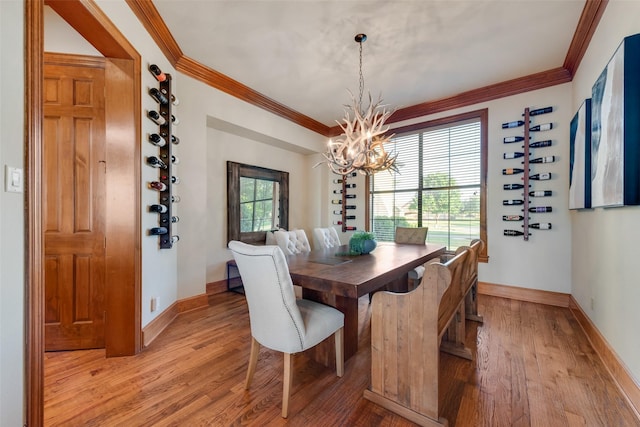 12624 Lake Shore Ct N, Fort Worth, TX 76179 - dining area with light wood-type flooring, a chandelier, and crown molding