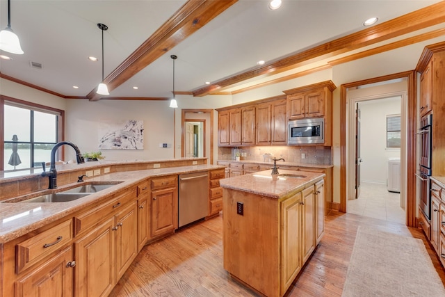 12624 Lake Shore Ct N, Fort Worth, TX 76179 - kitchen featuring stainless steel appliances, crown molding, light stone counters, backsplash, and a center island with sink