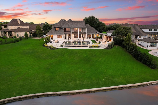 12624 Lake Shore Ct N, Fort Worth, TX 76179 - back of house featuring a patio area, a fenced backyard, an outdoor pool, and a shingled roof