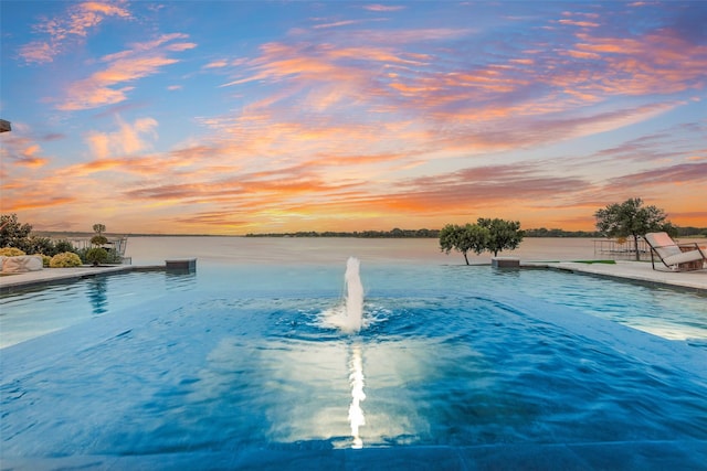 12624 Lake Shore Ct N, Fort Worth, TX 76179 - pool at dusk with an outdoor pool