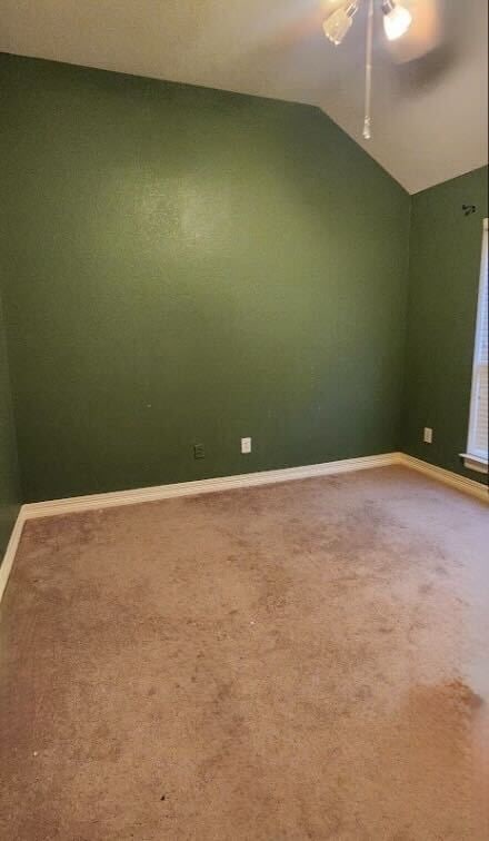 1005 W Bluff St, Fort Worth, TX 76102 - carpeted spare room featuring vaulted ceiling and baseboards