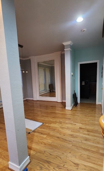1005 W Bluff St, Fort Worth, TX 76102 - hallway featuring light wood-type flooring and baseboards