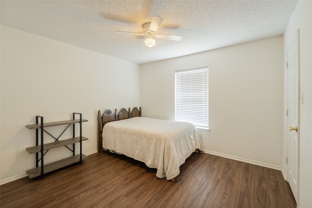 202 Lancelot Dr, Weatherford, TX 76086 - bedroom featuring dark wood-style floors, a textured ceiling, and a ceiling fan
