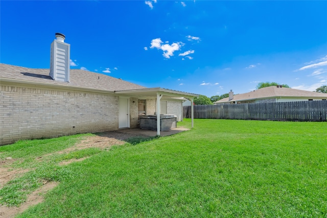 202 Lancelot Dr, Weatherford, TX 76086 - fenced backyard featuring a hot tub and a patio area