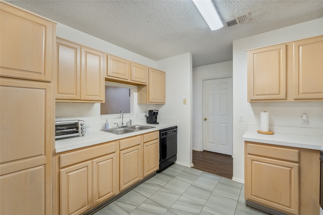 202 Lancelot Dr, Weatherford, TX 76086 - kitchen featuring light brown cabinetry, dishwasher, a textured ceiling, and light countertops