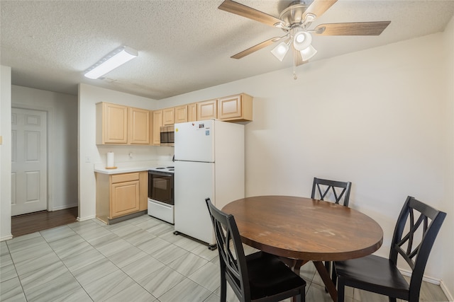 202 Lancelot Dr, Weatherford, TX 76086 - kitchen featuring white appliances, light brown cabinets, light countertops, a textured ceiling, and a ceiling fan