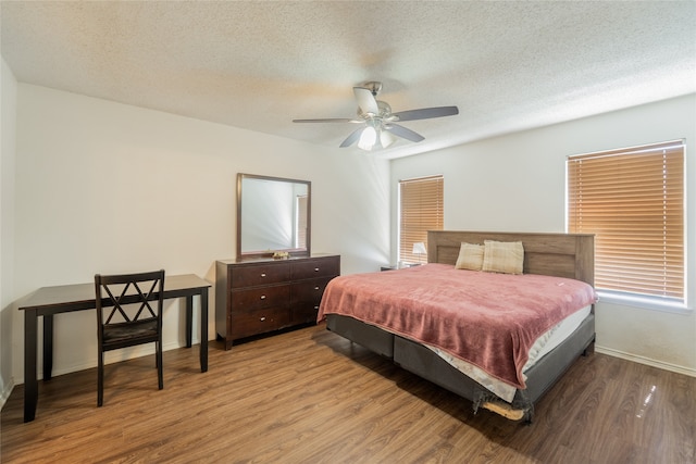 202 Lancelot Dr, Weatherford, TX 76086 - bedroom with wood finished floors, a textured ceiling, and a ceiling fan