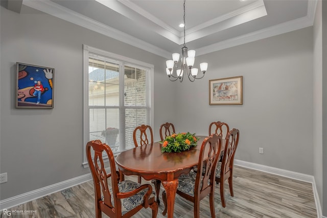 9424 N Pointe Cir, Greenwood, LA 71033 - dining space with light wood-style floors, a chandelier, recessed lighting, crown molding, and a raised ceiling