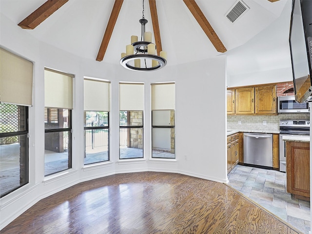 9101 Westwood Shores Dr, Fort Worth, TX 76179 - unfurnished dining area featuring healthy amount of natural light, high vaulted ceiling, beam ceiling, a chandelier, and light wood-type flooring