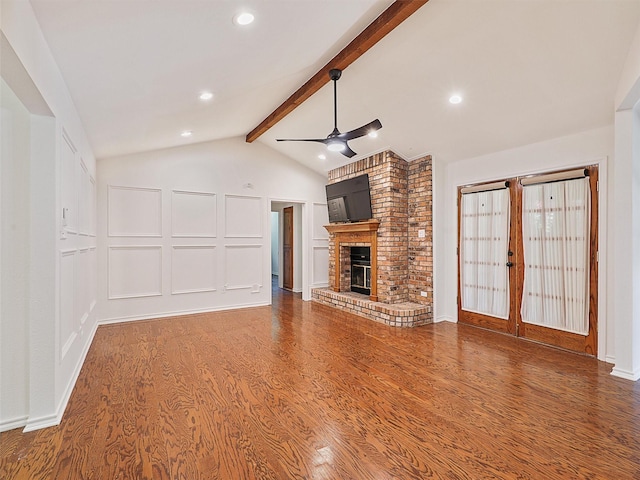 9101 Westwood Shores Dr, Fort Worth, TX 76179 - unfurnished living room with ceiling fan, wood finished floors, a fireplace, and recessed lighting