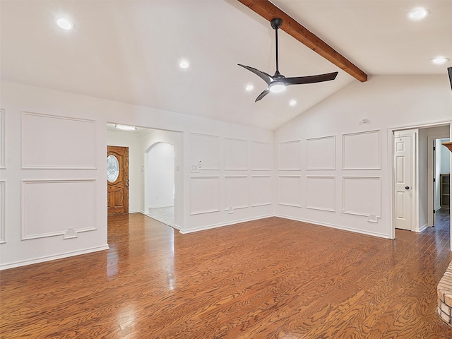9101 Westwood Shores Dr, Fort Worth, TX 76179 - empty room with a decorative wall, a ceiling fan, arched walkways, wood finished floors, and recessed lighting