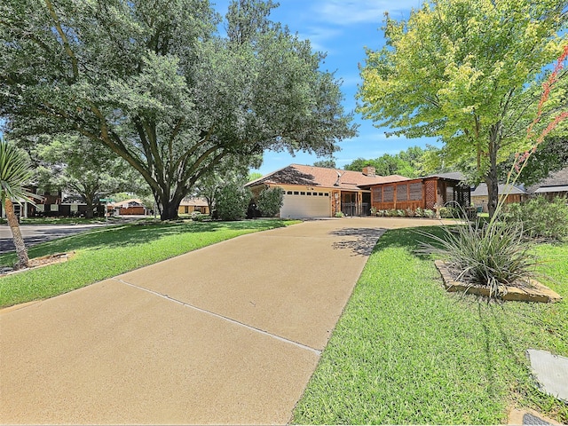 9101 Westwood Shores Dr, Fort Worth, TX 76179 - view of front of property with driveway, an attached garage, a front lawn, and a chimney
