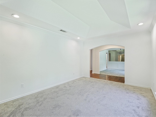 9101 Westwood Shores Dr, Fort Worth, TX 76179 - carpeted empty room featuring arched walkways, recessed lighting, ornamental molding, and a tray ceiling