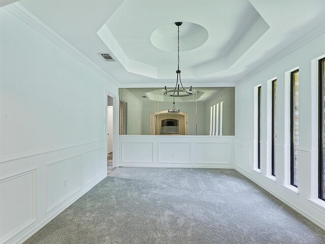 9101 Westwood Shores Dr, Fort Worth, TX 76179 - unfurnished living room with a decorative wall, a raised ceiling, carpet, wainscoting, and ornamental molding
