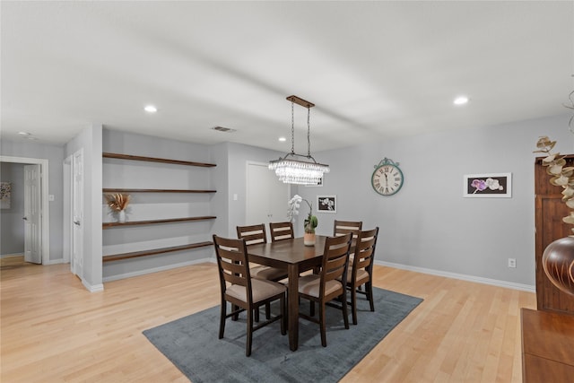 5963 River Bend Dr, Benbrook, TX 76132 - dining room with light wood-style flooring, recessed lighting, and a chandelier