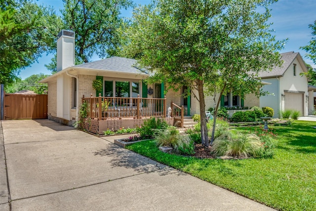 448 Parkhurst Dr, Dallas, TX 75218 - view of front of property with a chimney, covered porch, a front lawn, concrete driveway, and roof with shingles