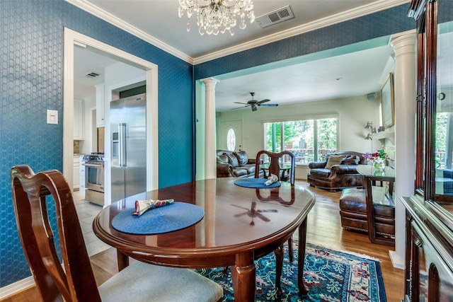 448 Parkhurst Dr, Dallas, TX 75218 - dining room with ornate columns, wallpapered walls, light wood finished floors, ceiling fan, and a chandelier