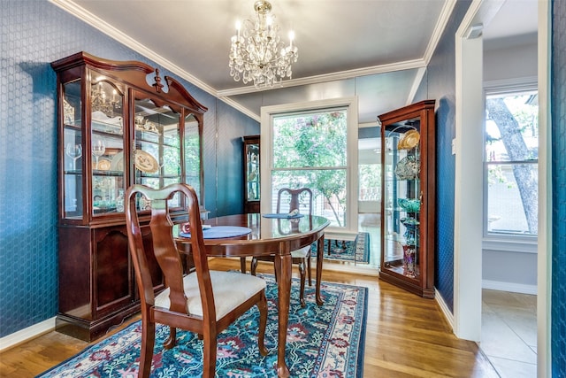 448 Parkhurst Dr, Dallas, TX 75218 - dining room featuring a chandelier, wallpapered walls, ornamental molding, and wood finished floors