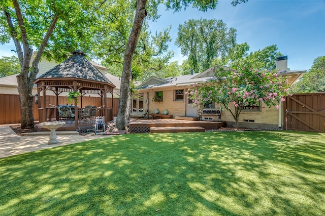 448 Parkhurst Dr, Dallas, TX 75218 - rear view of property with a chimney, a gazebo, a wooden deck, brick siding, and a gate