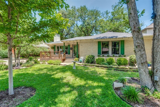 448 Parkhurst Dr, Dallas, TX 75218 - view of front of house featuring brick siding, a chimney, a front lawn, and covered porch