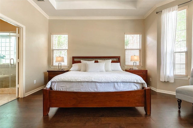 2324 Heather Ridge Dr, Flower Mound, TX 75028 - bedroom with dark wood-type flooring, multiple windows, ensuite bath, a raised ceiling, and ornamental molding