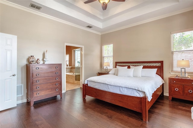2324 Heather Ridge Dr, Flower Mound, TX 75028 - bedroom featuring a raised ceiling, dark wood-style flooring, multiple windows, crown molding, and connected bathroom