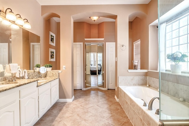 2324 Heather Ridge Dr, Flower Mound, TX 75028 - bathroom with vanity, plenty of natural light, a bath, and tile patterned flooring