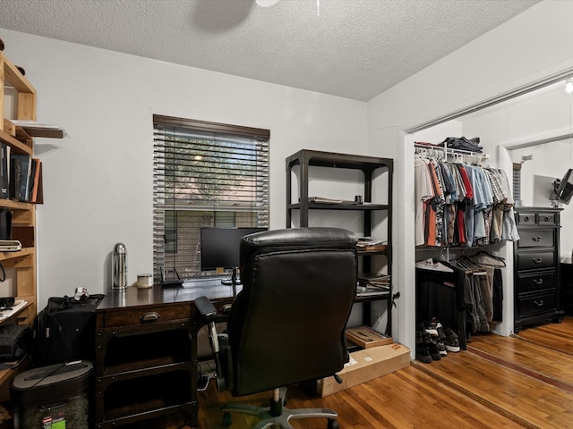 301 Redbud, Ferris, TX 75125 - office space featuring wood finished floors and a textured ceiling