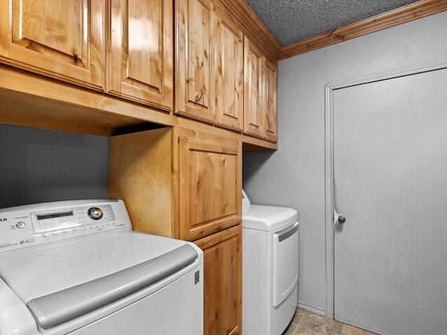 301 Redbud, Ferris, TX 75125 - laundry area featuring washer and dryer, cabinet space, and crown molding