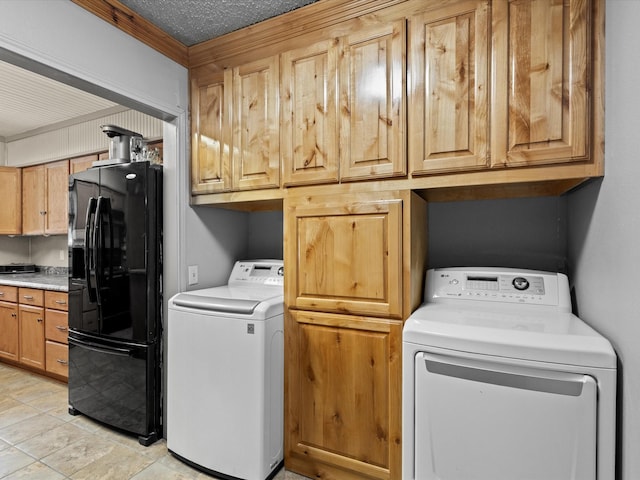 301 Redbud, Ferris, TX 75125 - washroom featuring washer and dryer, cabinet space, crown molding, and a textured ceiling