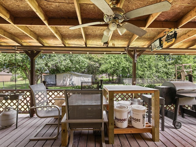 301 Redbud, Ferris, TX 75125 - wooden deck with a storage shed, ceiling fan, and outdoor dining area