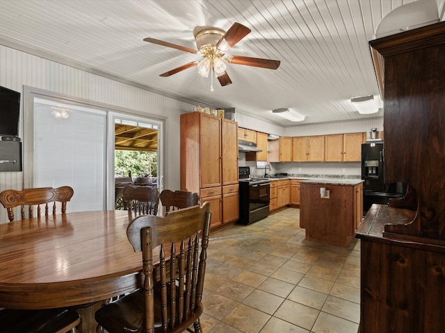 301 Redbud, Ferris, TX 75125 - dining room with a ceiling fan and light stone finish floors