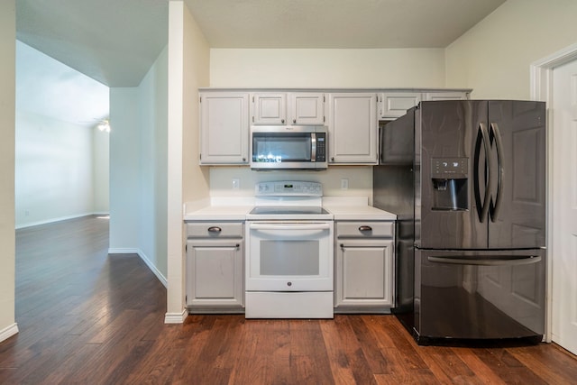 113 N W A Allen Blvd, Wylie, TX 75098 - kitchen featuring stainless steel microwave, fridge with ice dispenser, white range with electric cooktop, light countertops, and dark wood finished floors